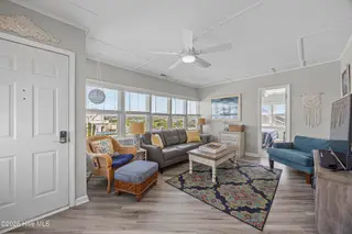 5127 W Beach Drive, Oak Island, NC 28465 – photo 10: 39_sun room