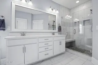 6476 Bryson Drive SW, Ocean Isle Beach, NC 28469 – photo 23: Gorgeous shower tiled to ceiling