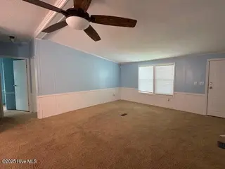 1554 Gate 2 SW, Ocean Isle Beach, NC 28469 — 3-bedroom manufactured home in Seaside North, Ocean Isle Beach, NC, photo 10 of 17: living room