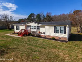 504 Timothy Drive, Elizabeth City, NC 27909 — 3-bedroom manufactured home in Timothy Acres, Elizabeth City, NC, photo 1 of 47: DJI_20260310111951_0247_Dedit