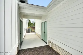 9599 Fallen Pear Lane NE, Leland, NC 28451 – photo 5: Breezeway to second garage
