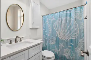501 Shoreline Drive E, Sunset Beach, NC 28468 – photo 21: Second full bathroom on main floor