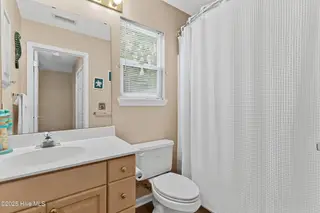 316 NE 52nd Street, Oak Island, NC 28465 – photo 23: 24_bathroom
