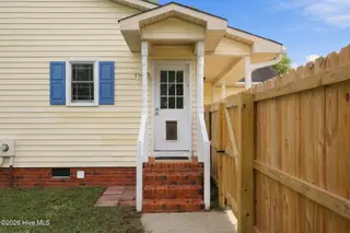2405 Harness Court, Greenville, NC 27858 — 3-bedroom home in Tucker East, Greenville, NC, photo 10 of 44: Left Side View Entry Door