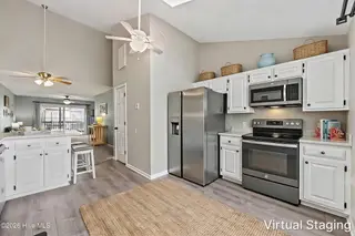1928 New River Inlet Road 214, North Topsail Beach, NC 28460 – photo 4: Kitchen Staged