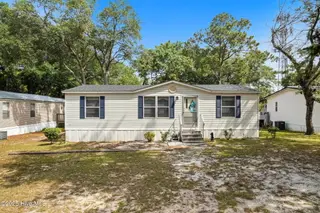7203 Banner Street SW, Ocean Isle Beach, NC 28469 — 3-bedroom manufactured home in Seaside Heights, Ocean Isle Beach, NC, photo 2 of 38: House Front