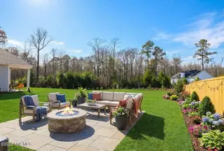 273 Ocean Pointe Boulevard SE 1801, Bolivia, NC 28422 – photo 3: AI Generated- backyard