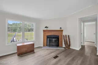 2216 Bell Williams Road, Burgaw, NC 28425 — 3-bedroom manufactured home, Burgaw, NC, photo 5 of 25: Sitting Area – Cozy Fireplace