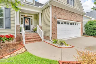 3918 Meeting Place Lane, Southport, NC 28461 — 4-bedroom home in Arbor Creek, Southport, NC, photo 2 of 57: Front