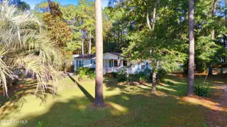 243 Ocean Forest Drive NW, Calabash, NC 28467 — 3-bedroom manufactured home in Ocean Forest, Calabash, NC, photo 23 of 61: DJI_20251101100212_0013_D