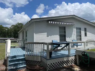 6883 Eastbrook Avenue SW, Ocean Isle Beach, NC 28469 — 2-bedroom manufactured home in Pine Acres, Ocean Isle Beach, NC, photo 15 of 25: Deck