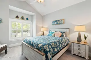 1353 Dunes Boulevard SW, Ocean Isle Beach, NC 28469 – photo 22: Guest 1 with vaulted ceiling