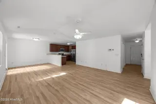 3414 Richard Court, New Bern, NC 28560 — 3-bedroom home in Pinecrest Estates, New Bern, NC, photo 16 of 38: living room to kitchen