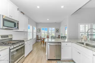8960 Smithfield Drive NW, Calabash, NC 28467 – photo 10: Kitchen to dining area