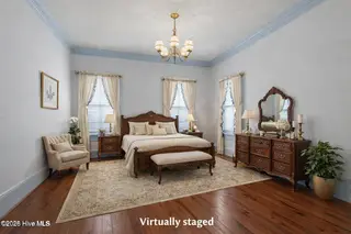 301 E Moore Street, Southport, NC 28461 – photo 20: Antique-styled bedroom with vintage char