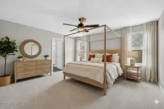 825 Seathwaite Lane SE, Leland, NC 28451 – photo 24: AI image of master bedroom