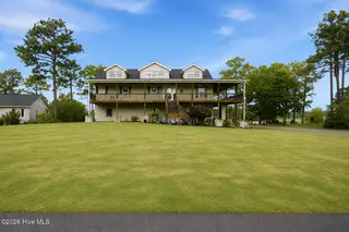 354 W South Shore Drive, Southport, NC 28461 — 3-bedroom home in Boiling Spring Lakes, Southport, NC, photo 1 of 39: 13 photo green grass