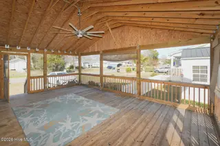 802 E Oak Island Drive, Oak Island, NC 28465 – photo 8: Screenedin Porch-026-011-1500x1000