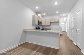 796 Palm Frond Way NW, Calabash, NC 28467 – photo 15: hallway view from casual dining