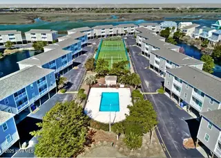 269 W Second Street 15g, Ocean Isle Beach, NC 28469 – photo 23: Starboard drone pic pool and tennis cour