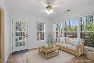 3803 Harmony Circle SE, Southport, NC 28461 – photo 18: virtually staged sunroom