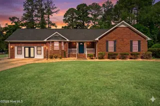 1813 Oberry Center Road, Goldsboro, NC 27530 – photo 1: Twilight Picture-Virtual sky and grass