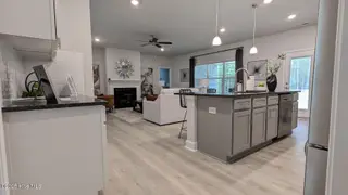 425 Sweet Potato Lane Lot 14, Nashville, NC 27856 – photo 18: kitchen and family room from garage-fran