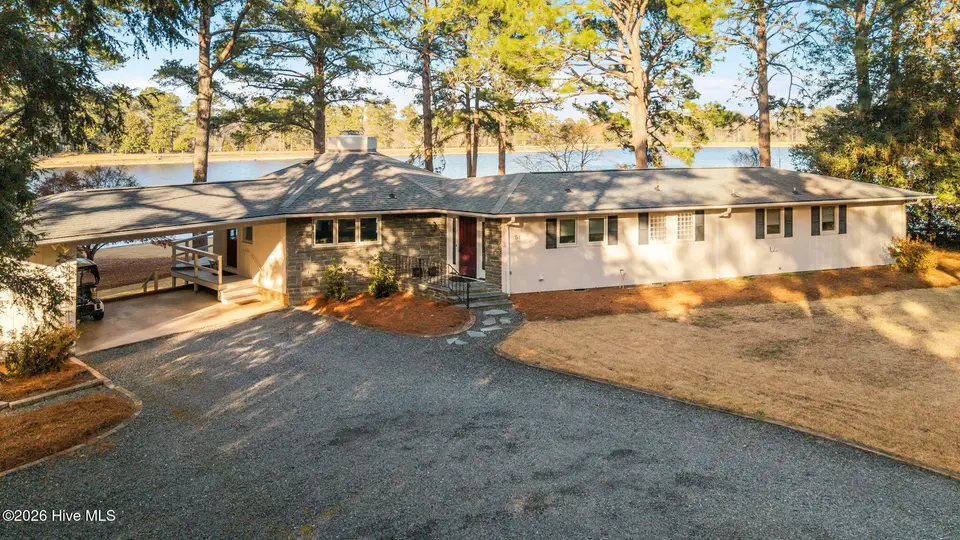 54 Pine Ridge Drive, Whispering Pines, NC 28327 – photo 1 of 56: Front of House