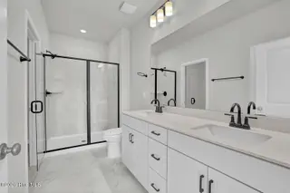 1210 Sunwater Terrace, Leland, NC 28451 — 3-bedroom townhome in Grand Park, Leland, NC, photo 16 of 46: Primary Bath