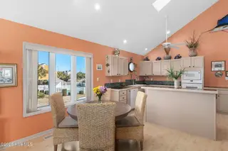 117 Island Quay Court, Atlantic Beach, NC 28512 – photo 6: Open concept dining room and kitchen