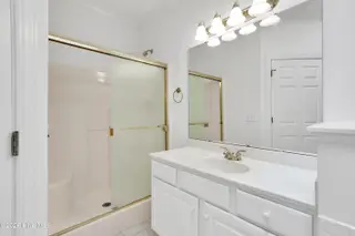 1009 N Sanderling Drive, Leland, NC 28451 — 3-bedroom townhome in Waterford of the Carolinas, Leland, NC, photo 22 of 63: Primary Bath