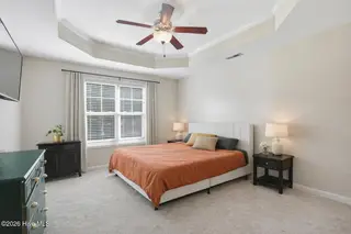 404 Hidden Oaks Drive, Jacksonville, NC 28546 – photo 15: Spacious bedroom with warm neutrals