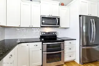3702 E Dolphin Drive, Oak Island, NC 28465 – photo 10: shniderproductions.com-35