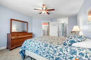 908 Resort Circle Unit 512, Sunset Beach, NC 28468 — 2-bedroom condo in Colony II, Sunset Beach, NC, photo 18 of 39: Primary Bedroom