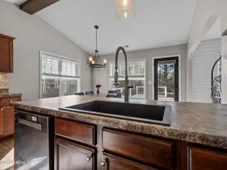 204 Demetrius Court, Hubert, NC 28539 — 3-bedroom home in Riggsfield, Hubert, NC, photo 16 of 31: Kitchen to dining