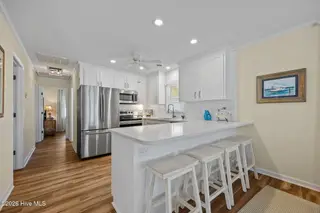 510 W Bogue Boulevard, Atlantic Beach, NC 28512 – photo 16: kitchen with island seating for 4