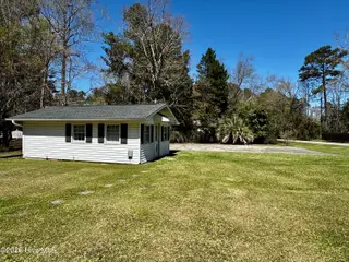 200 Elm Street, Whiteville, NC 28472 — 3-bedroom home, Whiteville, NC, photo 12 of 33: Parking pad beside storage/workshop