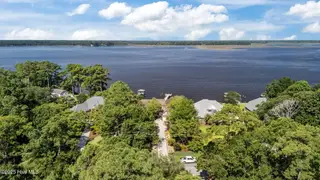 138 White Oak Bluff Road, Stella, NC 28582 – photo 6: 60-web-or-mls-DJI_20250725103053_0334_D