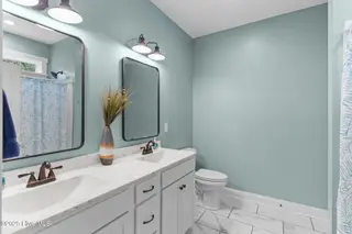 162 NW 9th Street, Oak Island, NC 28465 – photo 24: primary bath 1