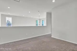 1214 Sunwater Terrace, Leland, NC 28451 — 4-bedroom townhome in Grand Park, Leland, NC, photo 13 of 39: Loft