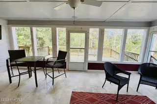 691 Harris Creek Road, Jacksonville, NC 28540 — 3-bedroom home, Jacksonville, NC, photo 2 of 41: oversized screened in back porch