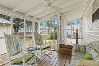 7203 Banner Street SW, Ocean Isle Beach, NC 28469 — 3-bedroom manufactured home in Seaside Heights, Ocean Isle Beach, NC, photo 20 of 38: Screen Porch