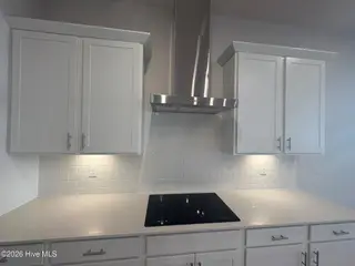 2024 Oakton Drive 15, Southport, NC 28461 – photo 13: GE Cooktop & Venthood