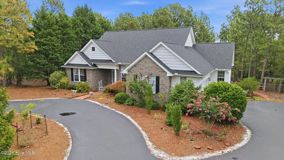 209 Longleaf Drive, West End, NC 27376 – photo 1 of 62: 2-web-or-mls-DJI_20260713113901_0710_D