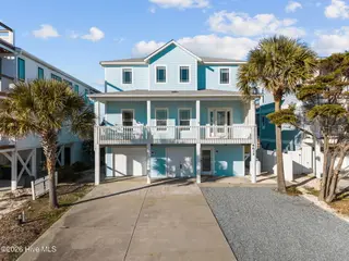 6634 Kings Lynn Drive, Oak Island, NC 28465 – photo 2: 2-web-or-mls-DJI_20260216160234_0499_D