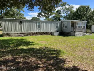 112 Pettiford Road, Peletier, NC 28584 — 3-bedroom manufactured home in Pettiford Point, Peletier, NC, photo 2 of 19: back