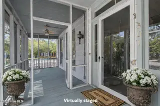 301 E Moore Street, Southport, NC 28461 – photo 13: Quiet porch with antique planters