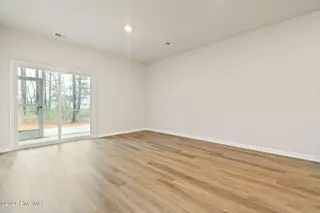 3583 Whaley Way NW, Ash, NC 28420 — 3-bedroom townhome in Brunswick Plantation, Ash, NC, photo 15 of 34: Living Room to Patio