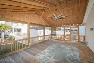 802 E Oak Island Drive, Oak Island, NC 28465 – photo 7: Screenedin Porch-025-022-1500x1000