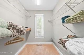 1714 Oakbrook Drive SW, Ocean Isle Beach, NC 28469 – photo 17: primary walk in closet